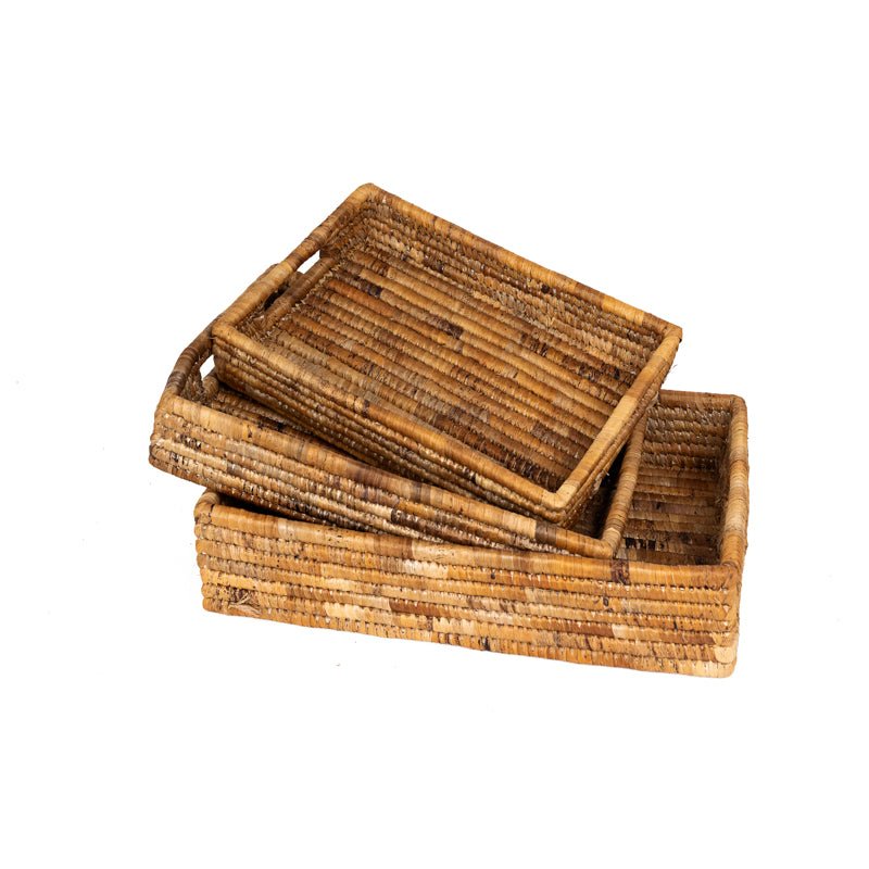 Banana leaf nesting tray set featuring three handcrafted trays made from natural banana leaves and stalks.