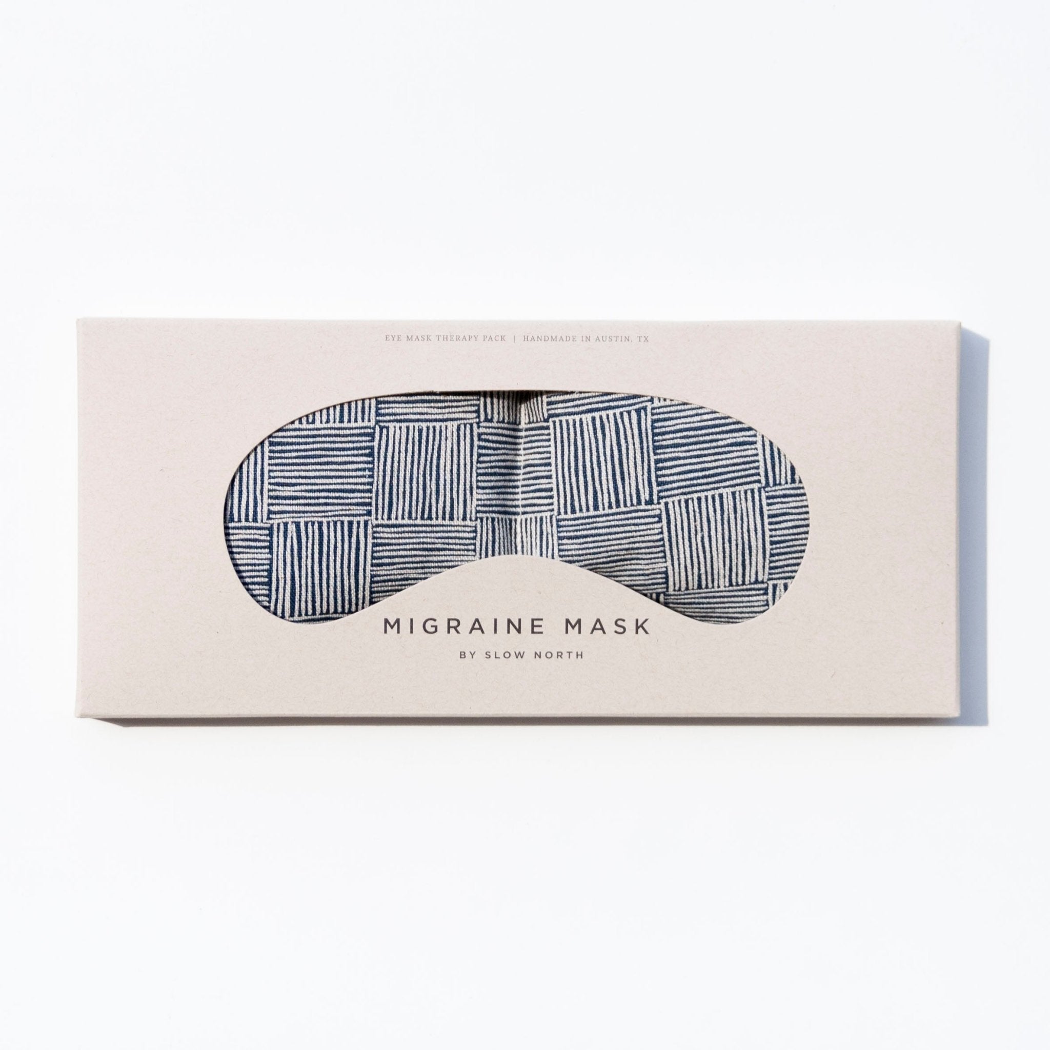 Migraine relief eye mask packaged in a stylish design with a neutral pattern for headache relief.