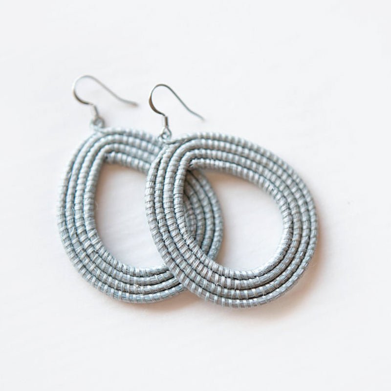 Hand-Woven Loop Earrings in light blue, crafted from natural sisal fibers for sustainable style.