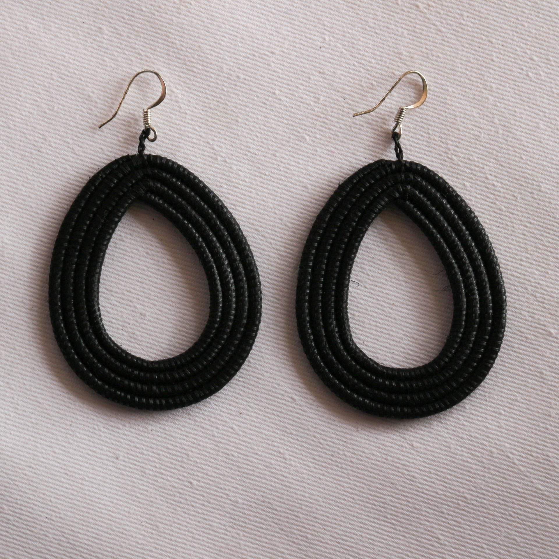 Hand-Woven Loop Earrings in black, featuring a unique teardrop shape, crafted from natural sisal fibers.