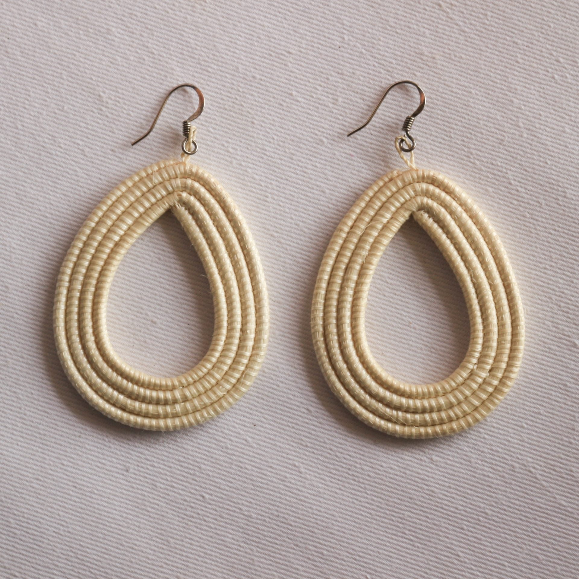 Hand-Woven Loop Earrings – Artisan statement jewelry crafted from natural fibers, showcasing modern elegance and lightweight design.